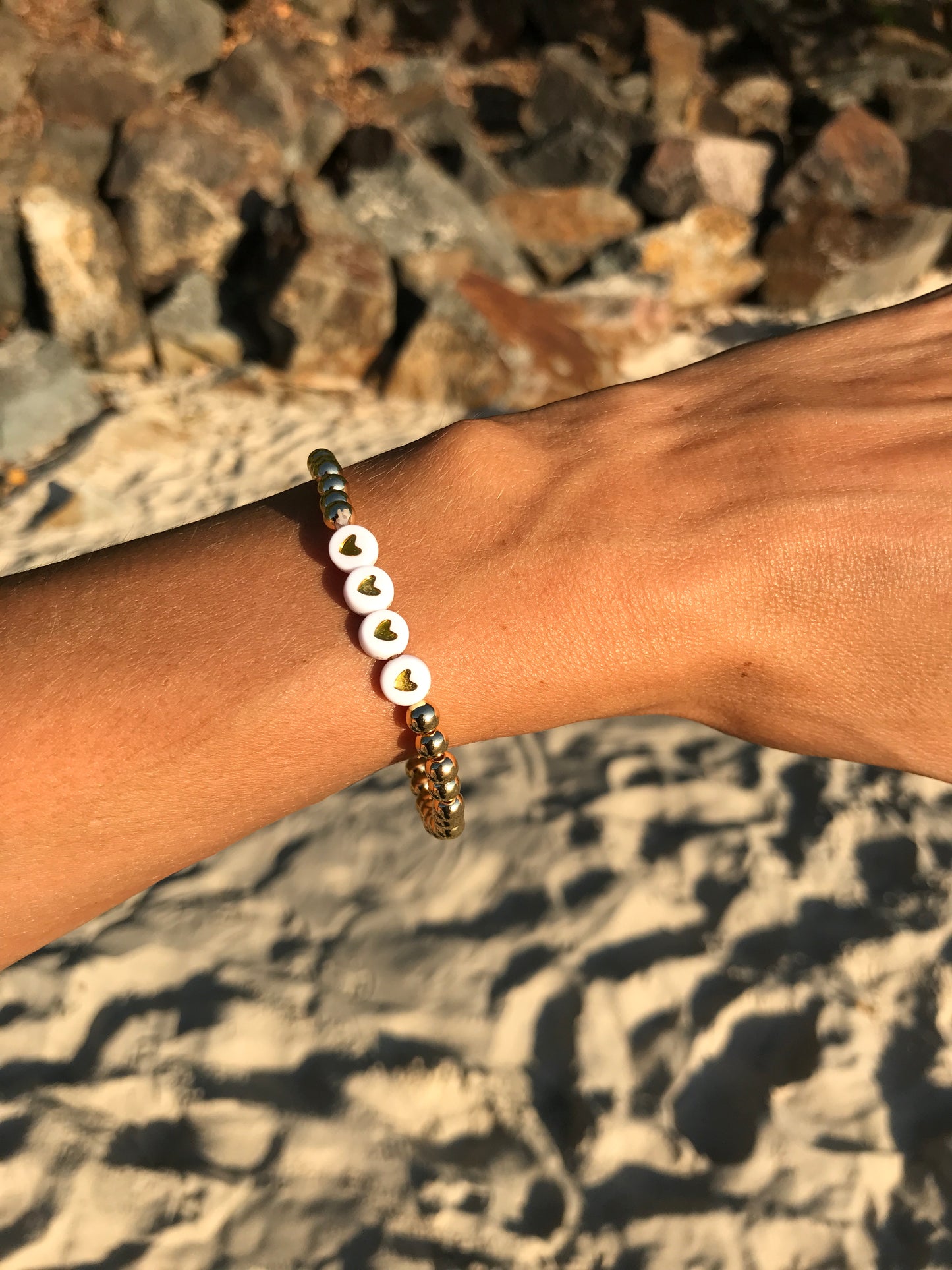 Golden stretch bracelet Scarlett 4 hearts