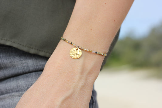 Golden “storm”, black and pink bracelet Alba