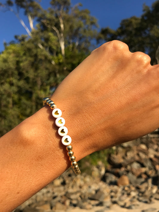 Golden stretch bracelet Scarlett 4 hearts