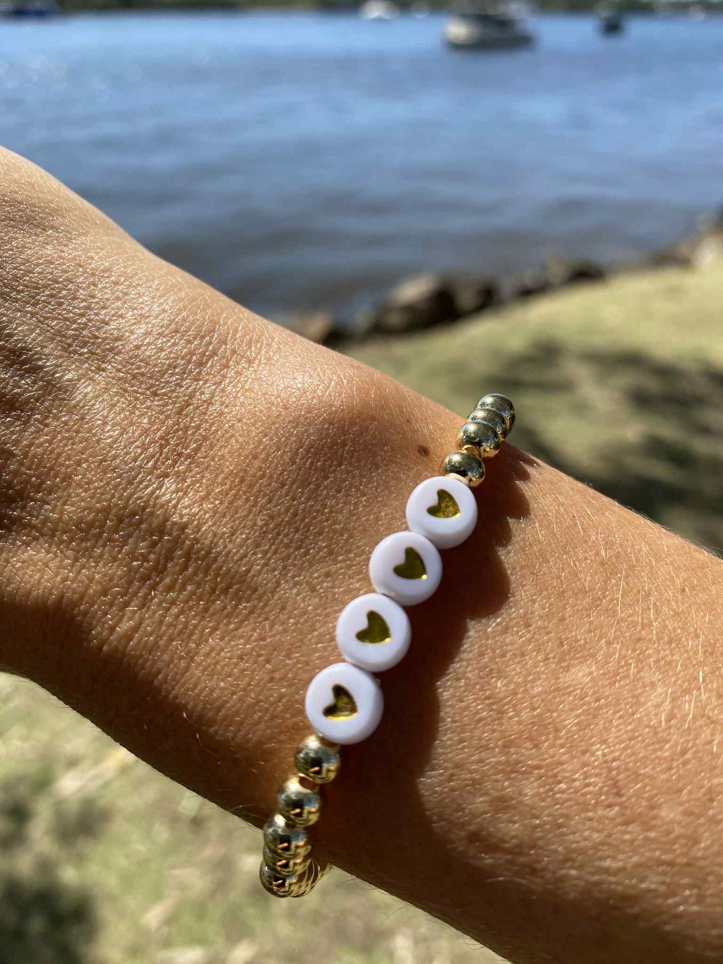 Golden stretch bracelet Scarlett 4 hearts
