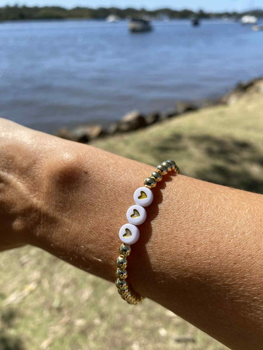 Golden stretch bracelet Scarlett 3 hearts